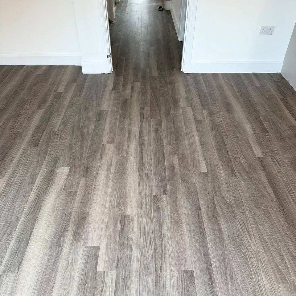 Wood-effect plank floor through a hallway